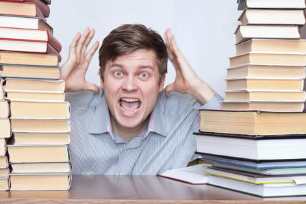 bigstock-Man-Between-Books-7052780-2